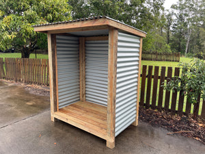 The image on our website is a photograph of our premium firewood shed. The shed is made of high-quality materials and has a spacious design that can hold a large amount of firewood. The shed is designed to keep your firewood dry and organized, and its stylish design will complement any outdoor space. The photograph shows the shed in a natural outdoor setting, surrounded by trees and greenery.